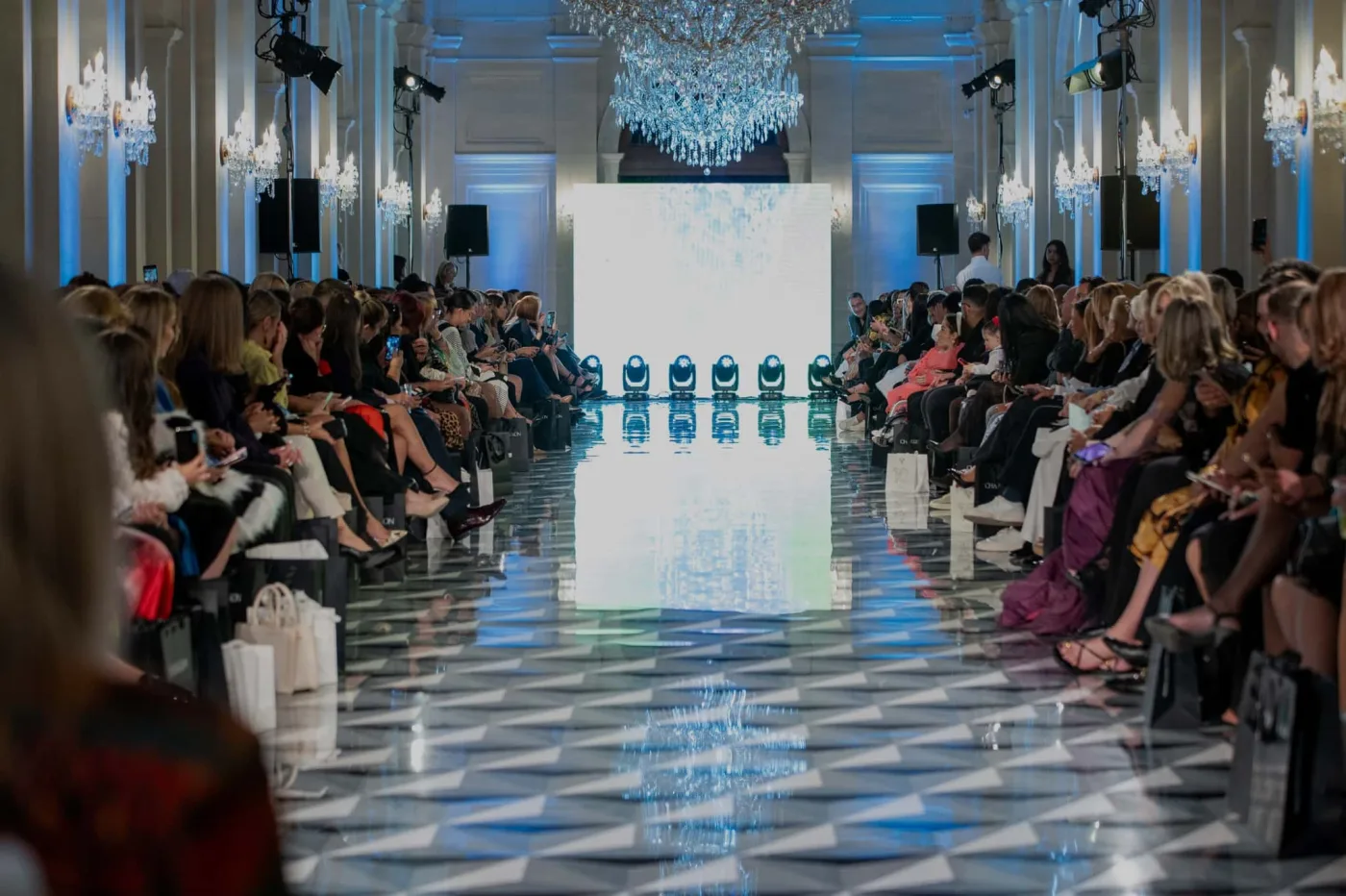 A runway show under the chandeliers at Montekristo Estate