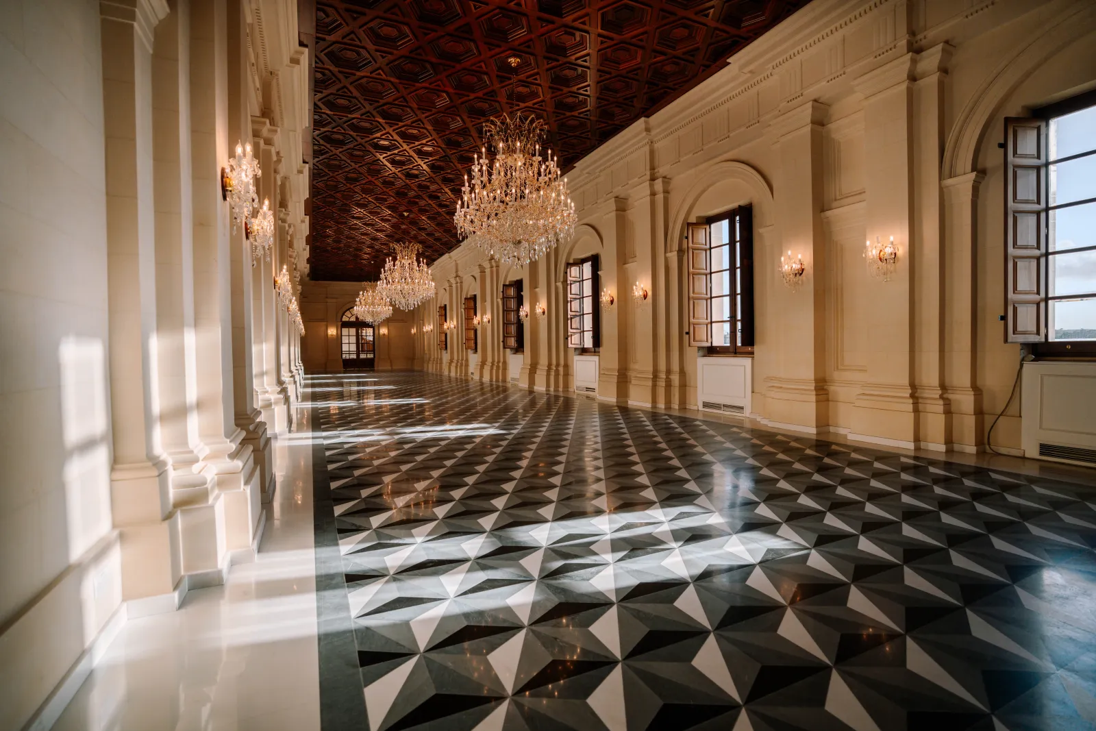 A long gallery lined with crystal chandeliers at Montekristo